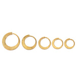 Hand forged 24ct gold hoops with a hand hammered finish.  Pure gold hoop earrings by Sarah Herriot.