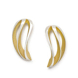 These angel twist earrings in silver are like curved wings with golden recesses to contrast the polished surfaces and accentuate the design. Angel Twist earrings by Sarah Herriot.