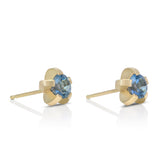 Splice stud earrings sit proud from the ear, holding a gorgeous blue aquamarine in 18ct gold. Splice aquamarine earrings by Sarah Herriot.
