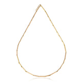 Crafted from solid 18ct gold, this necklace presents an abstract composition of articulated rod segments that flow seamlessly as one piece, it has an alluring weight and feels lovely on the skin. Perfect for those who appreciate minimalist aesthetics with architectural depth, understated luxury.  Bamboo necklace y Sarah Herriot.