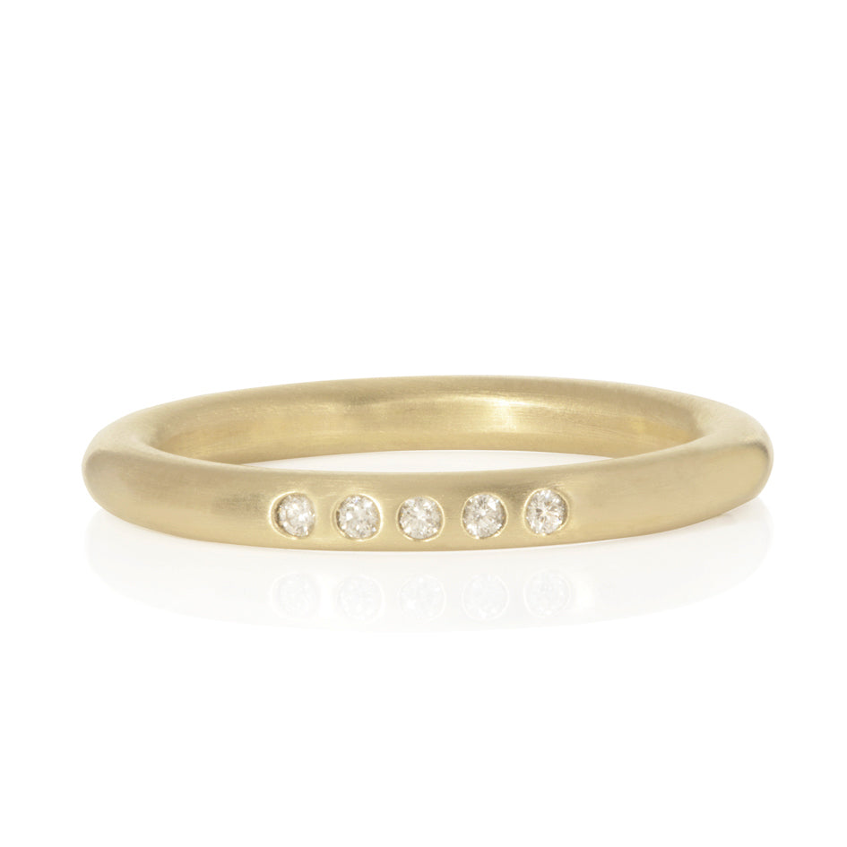 Soft textured bamboo ring in 18ct gold set with a delicate line of white diamonds.  Bamboo ring by Sarah Herriot.