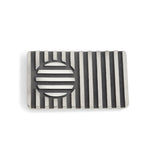 Beach ball brooch made of linear construction with an opposing cirular inset, blackened recesses accentuate the design. Beach ball brooch by Sarah Herriot.