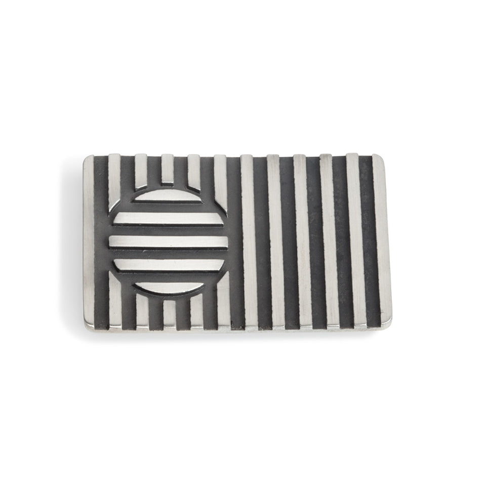 Beach ball brooch made of linear construction with an opposing cirular inset, blackened recesses accentuate the design. Beach ball brooch by Sarah Herriot.