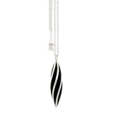Beat twist pendant is a wonderfully rythmic form in silver, constructed using twisted sheets of silver and oxidised or textured recesses to accentuate the sculptural nature of the piece.  Beat twist pendant by Sarah Herriot.