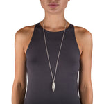 Beat twist pendant is a wonderfully rythmic form in silver, constructed using twisted sheets of silver and oxidised or textured recesses to accentuate the sculptural nature of the piece.  Beat twist pendant by Sarah Herriot.