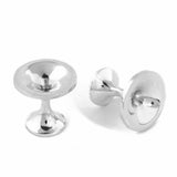 These striking cufflinks feature a distinctive vortex design that does right through the piece, crafted from polished silver, making them an intriguing choice for those who appreciate contemporary jewellery with conceptual appeal. Black hole cufflinks by Sarah Herriot.