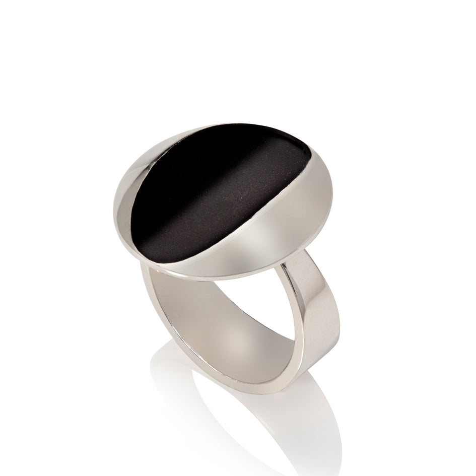Cats eye ring in silver with oxidised recess by Sarah Herriot.