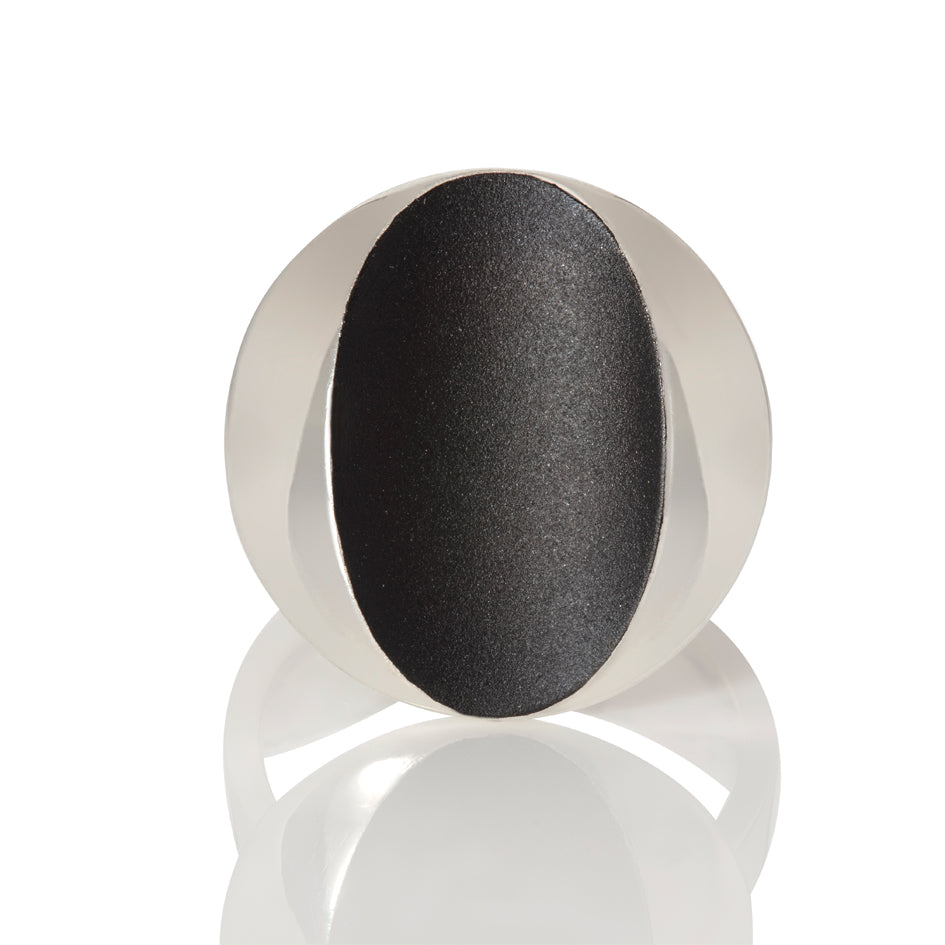 Cats eye ring in silver with oxidised recess by Sarah Herriot.