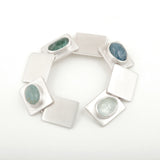 Commission bracelet in silver with clients own gemstones by Sarah Herriot.