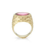 Strata ring in 18ct gold with beautiful rhythmic indented pattern covering the walls and set with a large juicy rubellite tourmaline. This ring has a flat base, so will stand up by itself, still working when not being worn. Strata ring by Sarah Herriot.