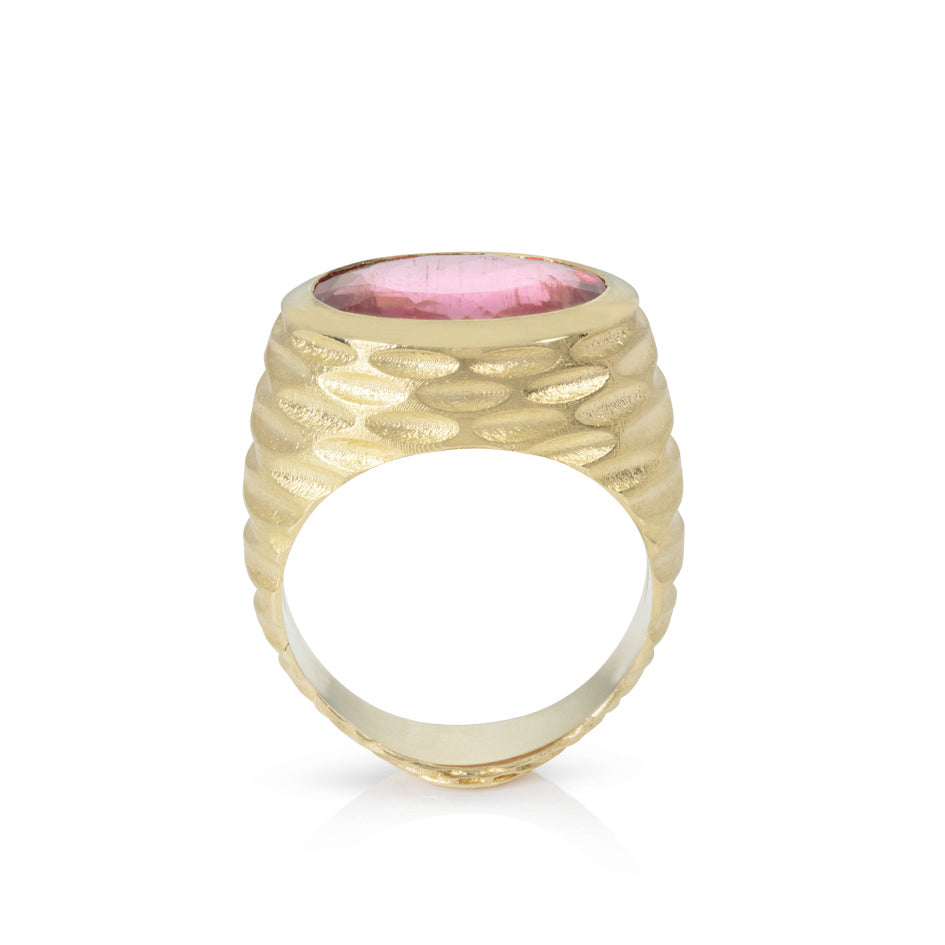 Strata ring in 18ct gold with beautiful rhythmic indented pattern covering the walls and set with a large juicy rubellite tourmaline. This ring has a flat base, so will stand up by itself, still working when not being worn. Strata ring by Sarah Herriot.