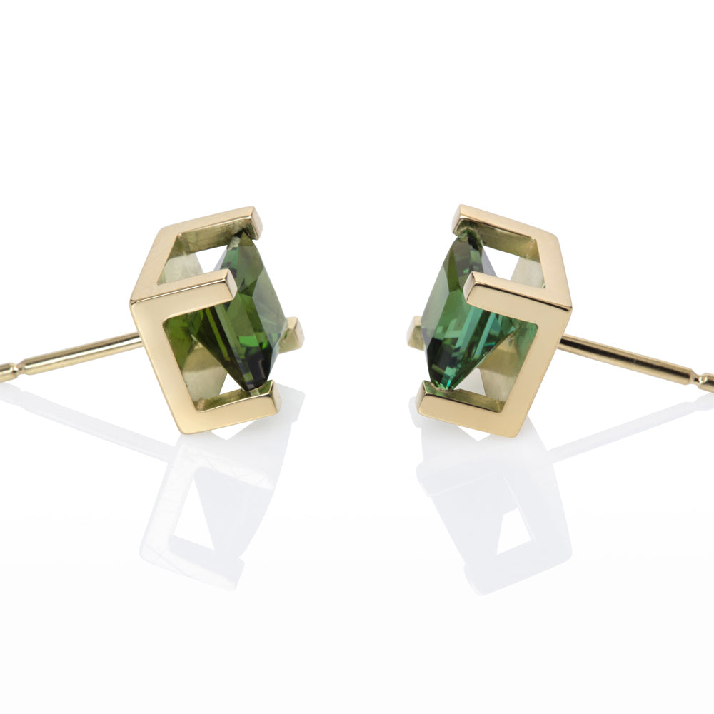 Crane stud earrings sit proud from the ear, holding gorgeous square green/turquoise tourmalines in 18ct gold frames. Crane earrings by Sarah Herriot.