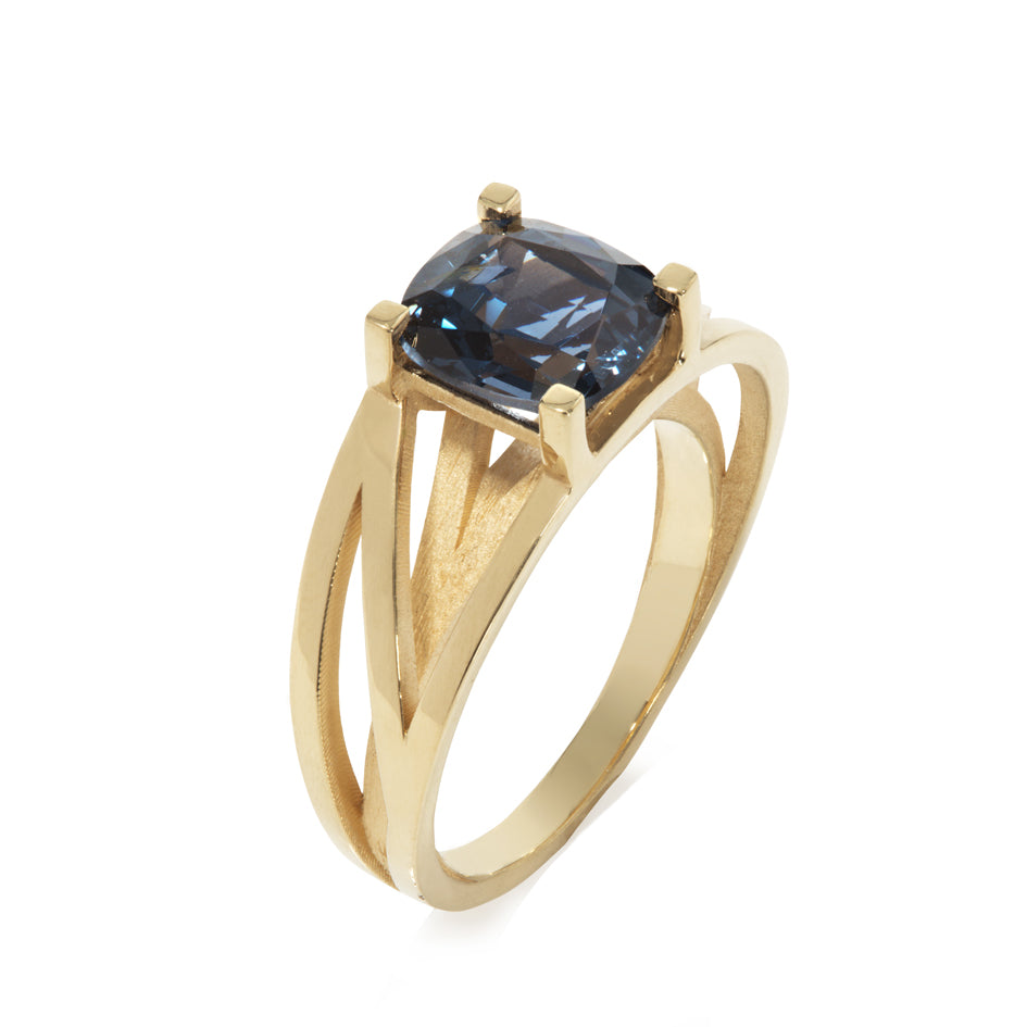 Crane ring in 18ct gold with cushion blue spinel by Sarah Herriot.
