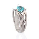 Platinum crane ring in platinum with clients trillion pariba tourmaline by Sarah Herriot.