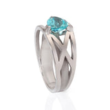 Platinum crane ring in platinum with clients trillion pariba tourmaline by Sarah Herriot.