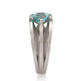 Platinum crane ring in platinum with clients trillion pariba tourmaline by Sarah Herriot.