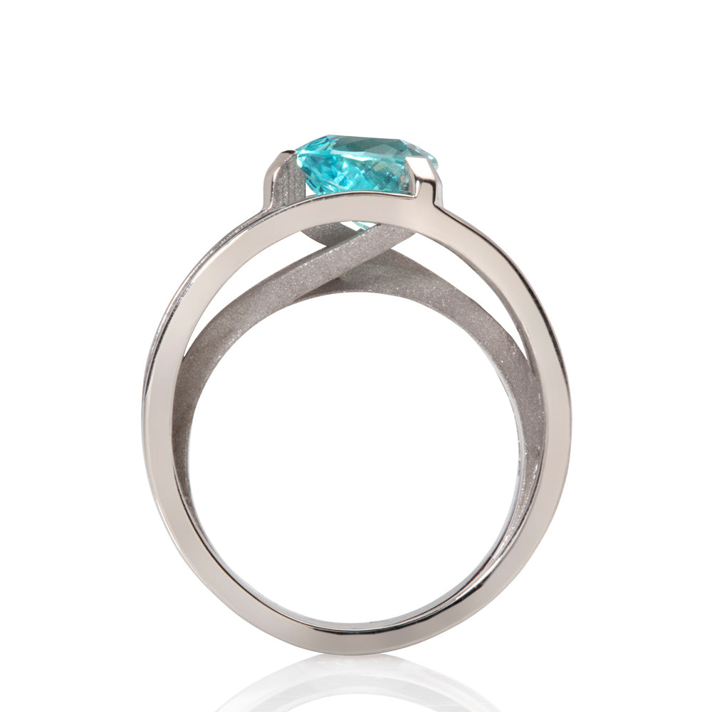 Platinum crane ring in platinum with clients trillion pariba tourmaline by Sarah Herriot.