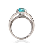 Platinum crane ring in platinum with clients trillion pariba tourmaline by Sarah Herriot.