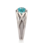 Platinum crane ring in platinum with clients trillion pariba tourmaline by Sarah Herriot.
