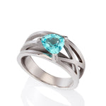 Platinum crane ring in platinum with clients trillion pariba tourmaline by Sarah Herriot.