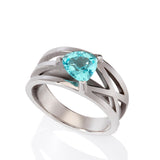 Platinum crane ring in platinum with clients trillion pariba tourmaline by Sarah Herriot.