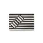 Deck chair brooch in silver made of linear construction with an opposing rectangular inset, blackened recesses accentuate the design. Deck chair brooch by Sarah Herriot.