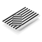 Deckchair brooch in silver with oxidised recesses by Sarah Herriot.