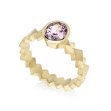 Intricate layered cube band ring in 18ct gold holds an elegant oval lavender spinel. Cube band ring by Sarah Herriot.