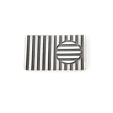 Disc brooch in silver with oxidised recesses by Sarah Herriot.