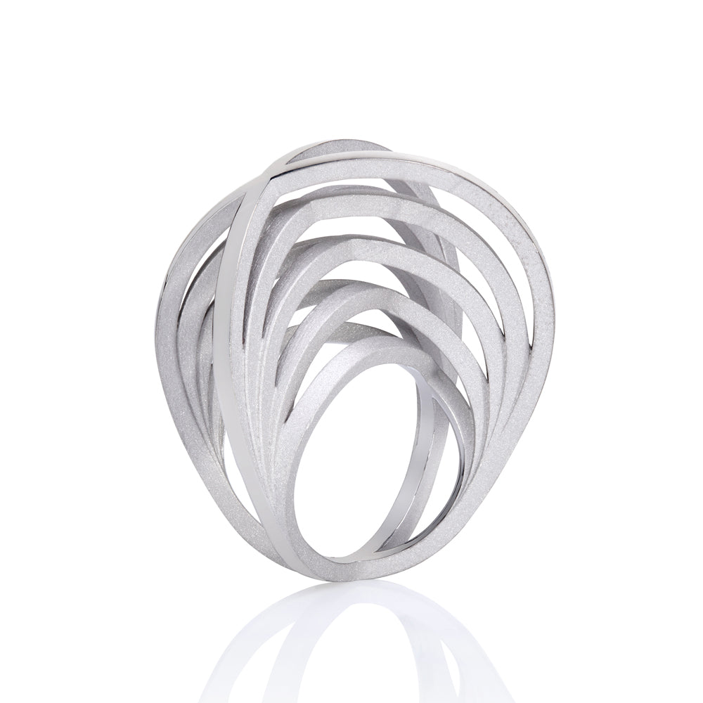 Double crane ring in silver with sandblasted surfaces and rhodium plating by Sarah Herriot.