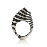 Eddy ring is a free form sculptural ring design with looping tapered bands accentuated by oxidised recesses. An abstract form with linear deconstruction. Eddy ring by Sarah Herriot.