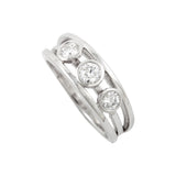 Engagement ring in platinum with round diamonds by Sarah Herriot.