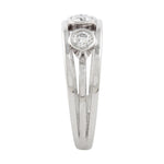Engagement ring in platinum with round diamonds by Sarah Herriot.
