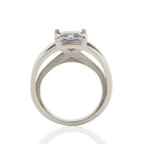 Crane ring in platinum with square grey/blue sapphire by Sarah Herriot.