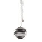 Escalator pendant is a clever design formed of spaced sheets of silver with a gently undulating surface where the oxidised recesses accentuate the form. An abstract form with linear deconstruction. Escalator pendant by Sarah Herriot.