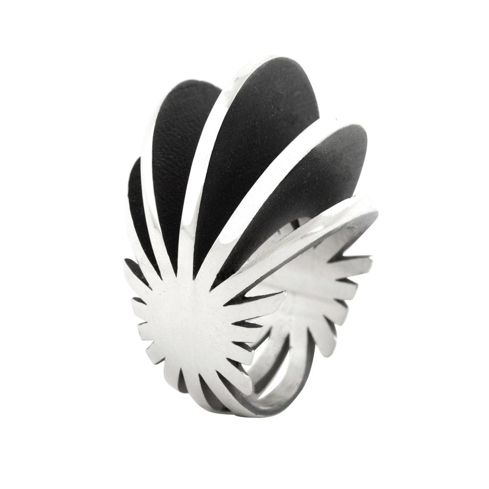 Fantastic ring is a wonderfully architecturally formed ring in silver, fanned sheets of silver with oxidised recesses to accentuate the sculptural nature of the piece. Fantastic ring by Sarah Herriot.