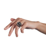 Fantastic ring is a wonderfully architecturally formed ring in silver, fanned sheets of silver with oxidised recesses to accentuate the sculptural nature of the piece. Fantastic ring by Sarah Herriot.