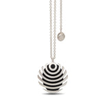 The fish button pendant is formed of strong linear curves creating a bold design in silver, the oxisided recess help to accentuate the form. Fish button pendant by Sarah Herriot.
