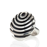 The fish button ring is formed of strong linear curves creating a bold design in silver, the oxisided recess help to accentuate the form.  Fish button ring by Sarah Herriot.