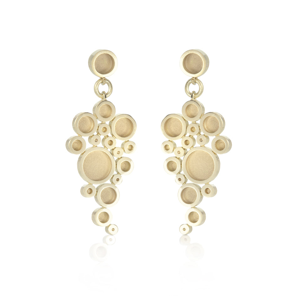 Galaxy earrings with sandblasted recesses in 18ct gold by Sarah Herriot.