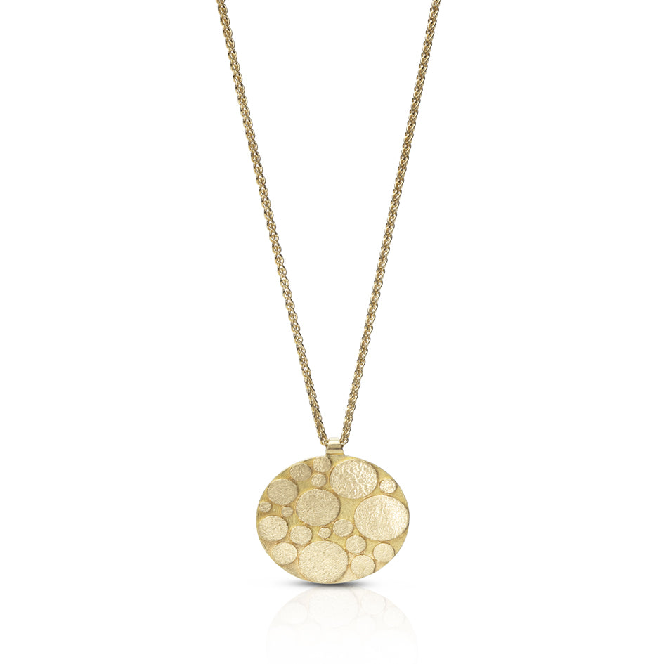 Galaxy necklace is an elegant construction using oval motif in 18ct gold. Sarah's imagining of the night sky, packed full of stars, as it was in her childhood in New Zealand. Her design runs through both sides of the surface, one side convex, the other concave. Galaxy necklace by Sarah Herriot.