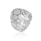 Galaxy ring is an elegant construction using circle motif in platinum. Galaxy ring by Sarah Herriot.