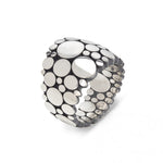 Galaxy ring is an elegant construction using circle motif in sterling silver. Sarah's imagining of the night sky, packed full of stars, as it was in her childhood in New Zealand.  Galaxy ring by Sarah Herriot.
