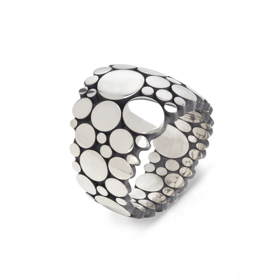 Galaxy ring is an elegant construction using circle motif in sterling silver. Sarah's imagining of the night sky, packed full of stars, as it was in her childhood in New Zealand.  Galaxy ring by Sarah Herriot.