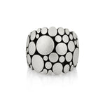 Galaxy ring is an elegant construction using circle motif in sterling silver. Sarah's imagining of the night sky, packed full of stars, as it was in her childhood in new zealand.  Galaxy ring by Sarah Heriot.
