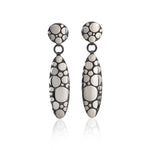 Galaxy drop earrings are an elegant construction using a circle motif on front and back of the piece, in oxidised silver.  Galaxy drop earrings by Sarah Herriot.