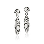 Galaxy drop earrings are an elegant construction using a circle motif on front and back of the piece, in oxidised silver.  Galaxy drop earrings by Sarah Herriot.