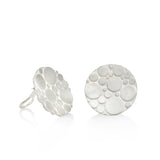 Galaxy clip earrings are an elegant construction using a circle motif on front and back of the silver piece. Galaxy clip earrings by Sarah Herriot.