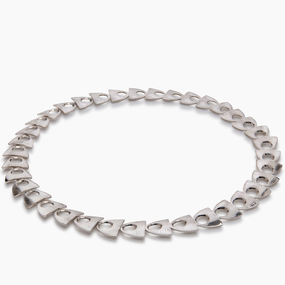 Herring neckpiece with deep textured silver by Sarah Herriot.