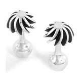 Holiday cufflinks have a twist of silver sheets to form a palm top, and a ball ending, while the oxidised recesses help accentuate the form. An abstract form with linear deconstruction which will free stand when not being worn. Holiday cufflinks by Sarah Herriot.